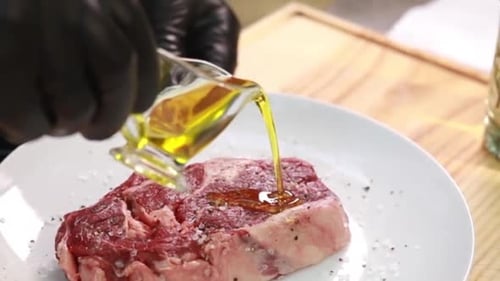 the chef prepares delicious meat in the restaurant