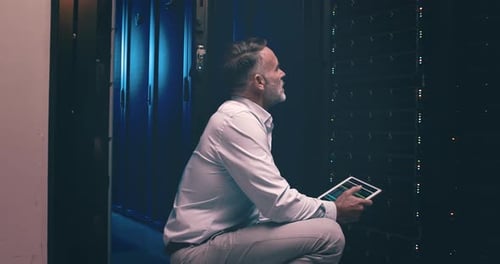 Face of happy man in data center with tablet, network maintenance and engineer in digital storage