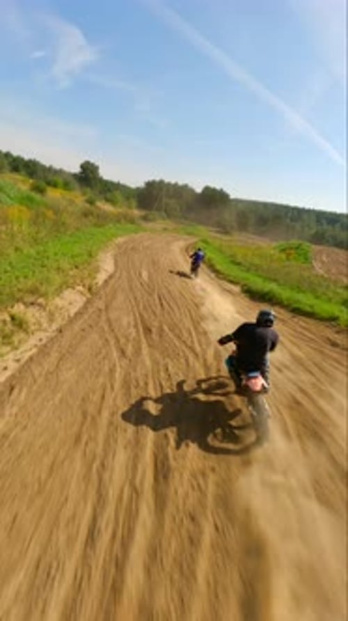 Dirtbikes Racing on a Rural Track