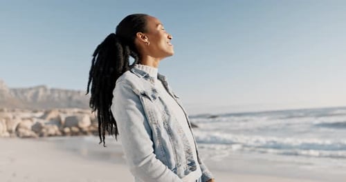 Smile, relax and black woman on beach for holiday on calm tropical island in summer with waves