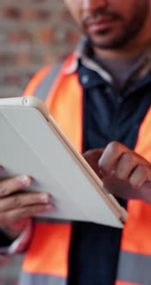 Builder, online and hands with tablet in building, search or safety inspection with info on website