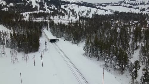 4K Drone Shot of Gondola, Train Tracks, and Ski Resort