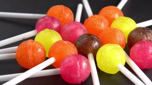 Colorful Lollipops Arranged on a Dark Background