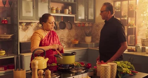 Senior Couple Cooking Together in Traditional Kitchen