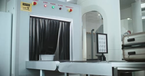 Suitcase Going Through Airport Security X-Ray Scanner