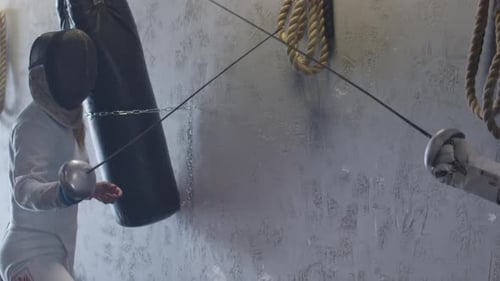 Female fencer being attacked and defeats opponent in slow motion