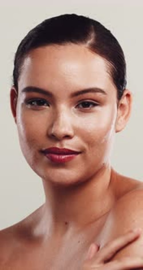 Skincare, face or woman in studio with touch, facial glow or shine in cosmetology