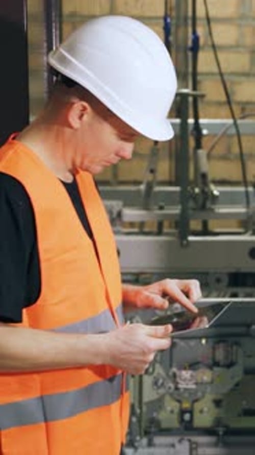 Construction worker using tablet