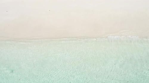 tropical beach, top view of the turquoise sea beautifully spreading on the white sand at the beach i