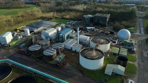 Aerial view of industrial plant with tanks, United Kingdom.
