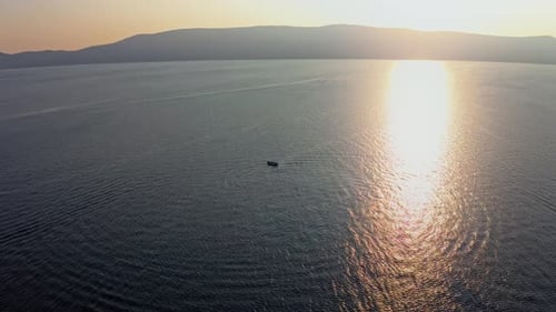 Aerial drone shot of the speed boat drifting on the ocean 14