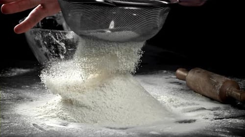 The Cook Sifts the Flour Filmed on a Highspeed Camera at 1000 Fps