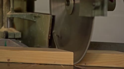 Close-Up of Power Saw Cutting Wood in Action