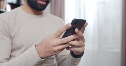 Close Up of Smartphone in Hands of Man While He Tapping and Texting Message Male Typing Sms on