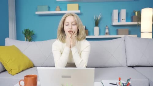 Frustrated young woman grieves helplessly.