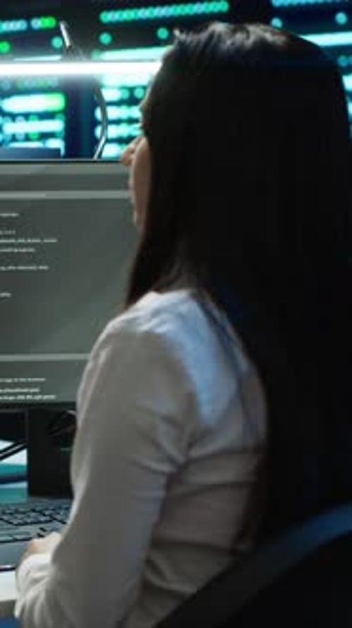 Vertical Video Team of Technicians in Data Center Managing Infrastructure