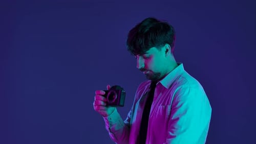 Backstage Photographer in Studio Shooting with Camera