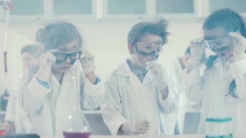 Young Students Experimenting in Science Lab