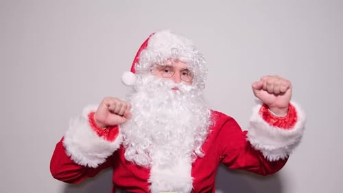 Santa Claus Pumping Fists in Celebration of Christmas