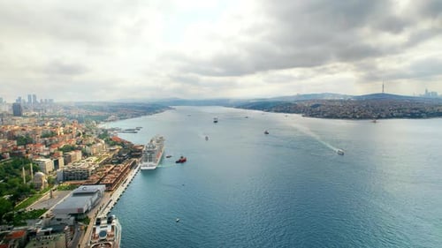 Aerial drone view of Istanbul, Turkey. Bosporus strait with multiple floating ships, residential bui