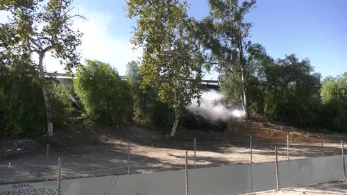 Brush Fire Burning in Embankment