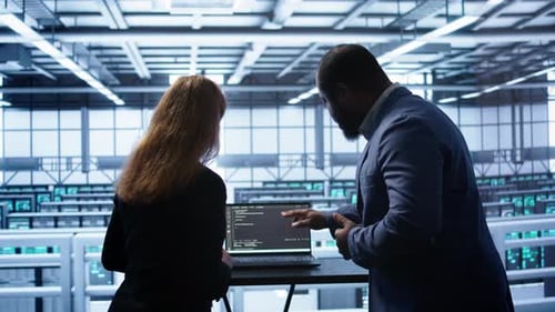 Team of Engineers in Data Center Doing Brainstorming to Fix Problems