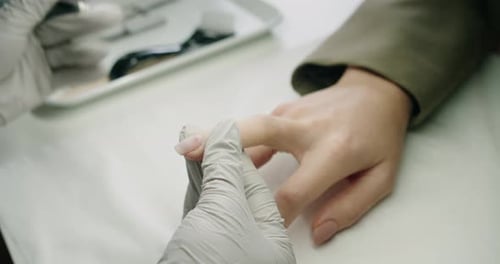 Woman Having a Manicure at Nail Salon