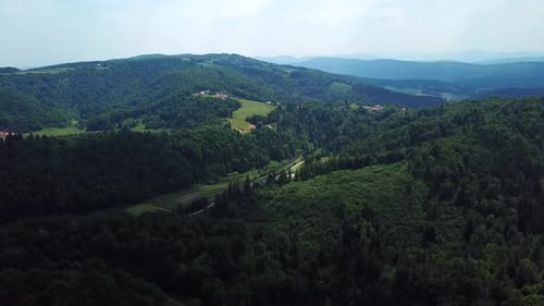 Aerial shot of a green mountain forest landscape
