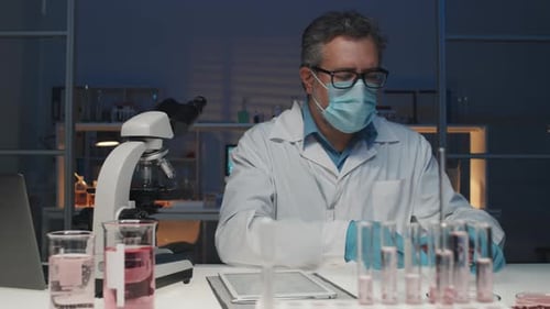 Researcher Inspects Lab-Grown Meat Sample in Lab