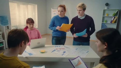 Team Brainstorming Data at Modern Workplace Meeting