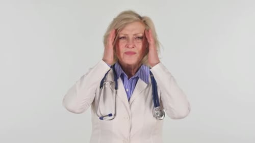 Doctor Woman with Headache Rubbing Temples