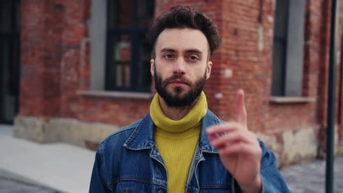 Serious Wise Young Handsome Man with Beautiful Hair Pointing to Camera Portrait of Attractive