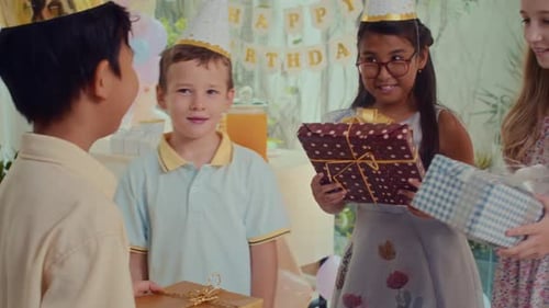 Kids Celebrate Birthday with Gifts and Friends