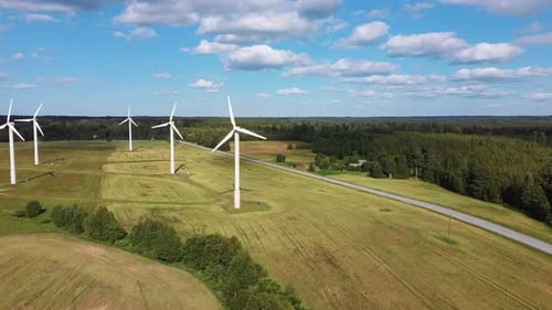 Aerial View of Wind Farm or Wind Park, With High Wind Turbines for Generation Electricity 4K UHD