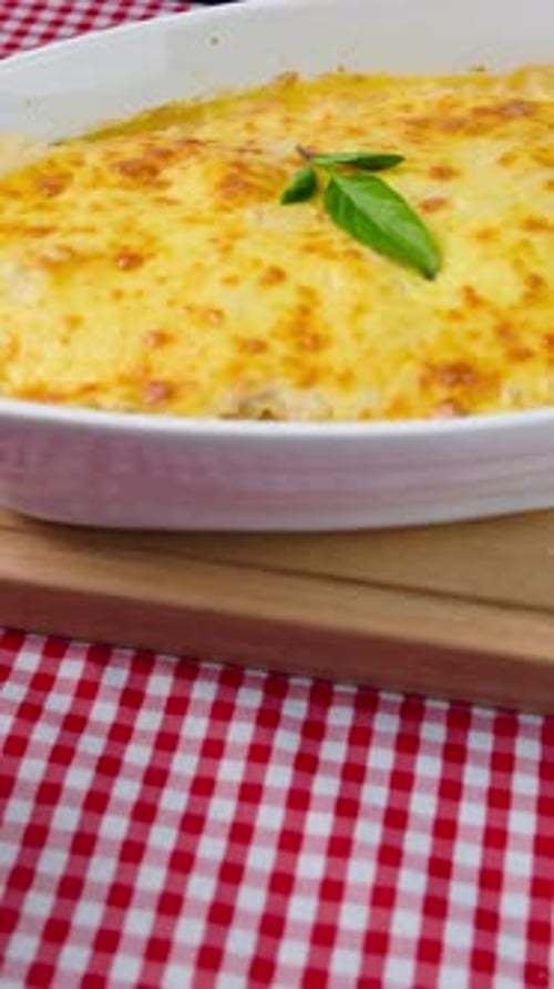 Lasagna Dish with Red Wine on Checkered Cloth