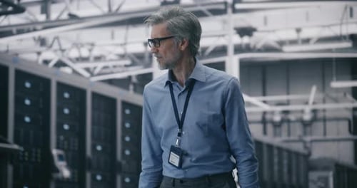 Engineer Inspecting Data Center Server Room Walkthrough