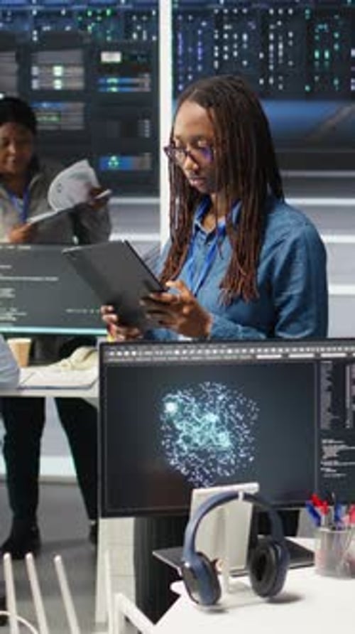 Vertical Video Woman in Server Hub Using AI Visualization Insights on Tablet Device