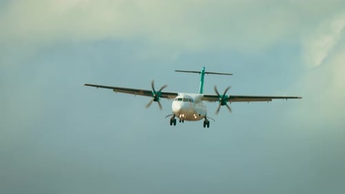 Airplane Approaching for Landing on Cloudy Day