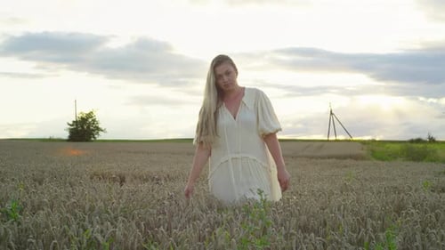 The Wheat Field Becomes a Place of Rest and Reflection for the Woman