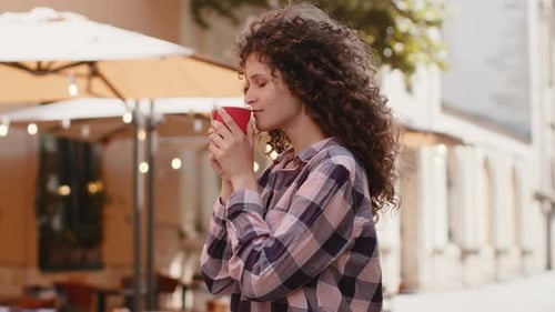 Young Woman Girl Enjoying Drinking Morning Coffee Hot Drink Relaxing Taking a Break in City Street