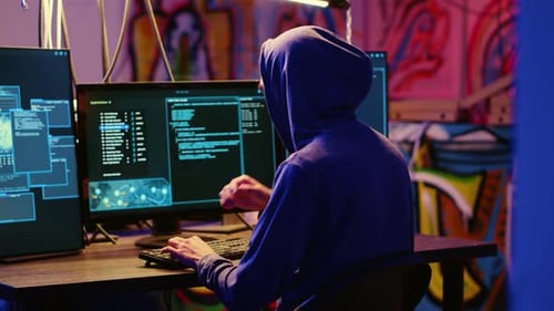 Hacker in Graffiti Painted Hideaway