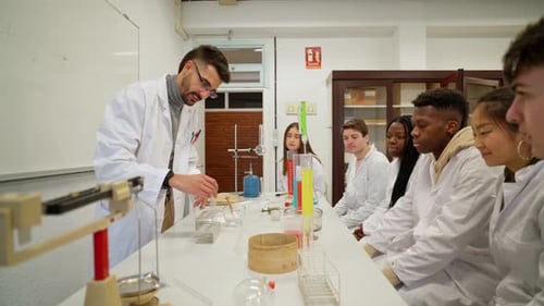 Science Students Watching Chemistry Experiment in Classroom