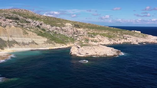 Aerial view of rocky coastline and island, Malta.