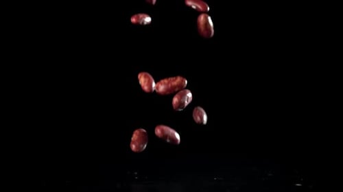 Red Beans Fall on the Table Filmed on a Highspeed Camera at 1000 Fps