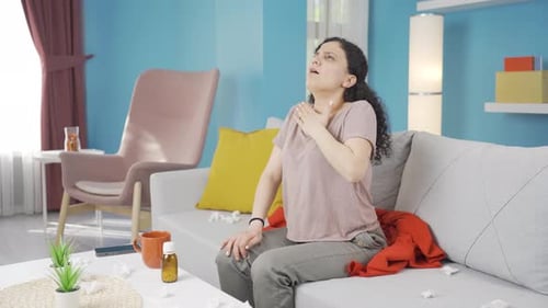 Young woman with shortness of breath is breathing hard.