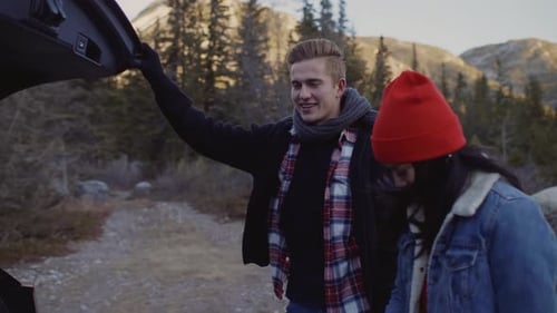 Friends by Car Trunk Getting Ready for Hike
