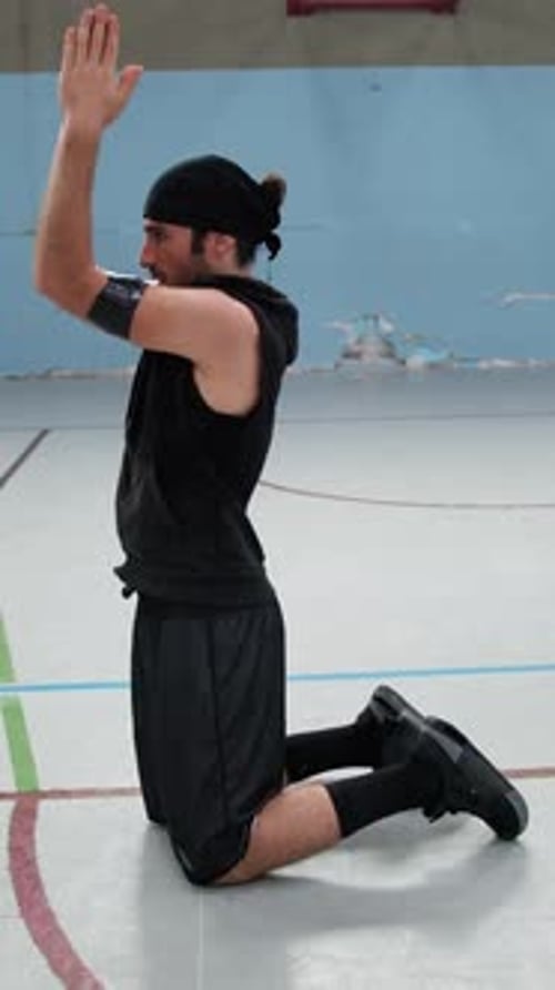 Athlete Moves His Arms In The Field To Do Stretching