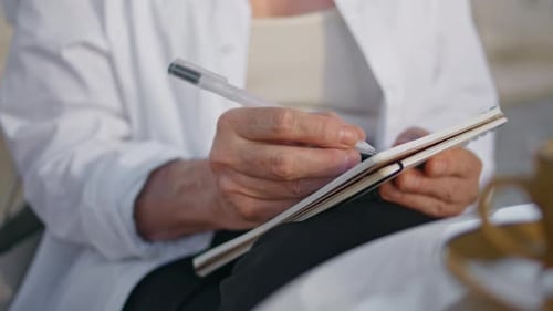 Senior Woman Hands Writing in Notebook Outdoors Close Up Old Lady Holding Pen
