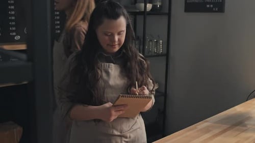 Woman With Disability At Work In Cafe