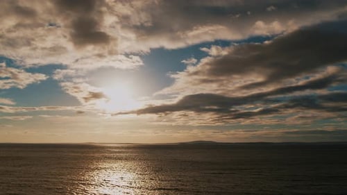 Cinematic View of a Beautiful Dramatic Sea Sunset with Clouds